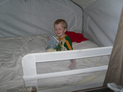 Boy on Bed Inside Motorhome Rental