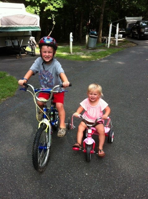 Children Riding a Bicycle with Training Wheels